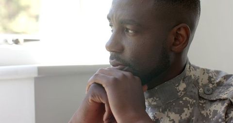 Thoughtful african american soldier contemplating life