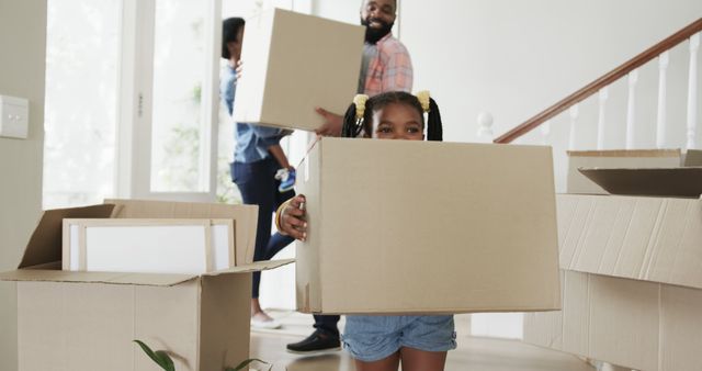 Happy African American Family Moving into New Home Holding Cardboard Boxes - Download Free Stock Images Pikwizard.com