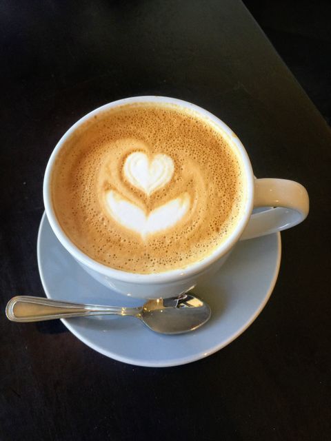 Perfect for coffee shops, restaurants, cafe menus, food blogs, or advertisements related to coffee. This photo of a beautifully crafted latte with heart-shaped latte art enhances themes of warmth, comfort, and care.