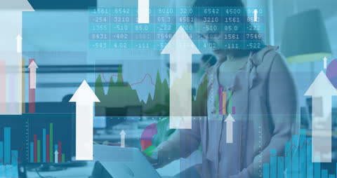 Businesswoman Analyzing Financial Data with Upward Graphs