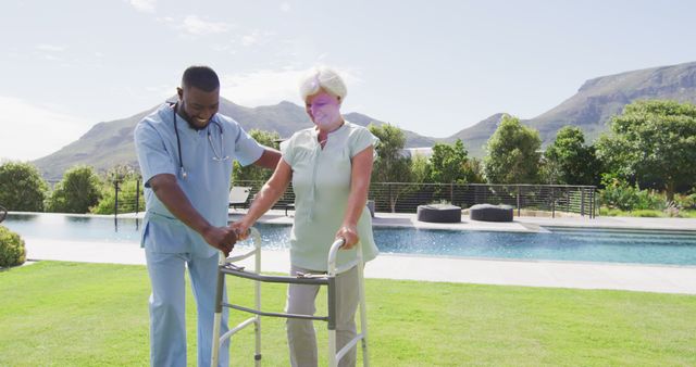 Caregiver assisting senior woman with walker outdoors by pool on sunny day. Useful for themes of elderly care, rehabilitation, healthcare support, nursing, retirement living, and physical therapy.