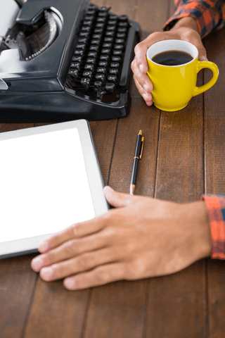 transparent workspace: coffee, tablet, typewriter on wooden table - Download Free Stock Videos Pikwizard.com
