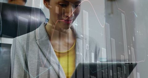 Caucasian Businesswoman Analyzing Data on Tablet with Digital Charts