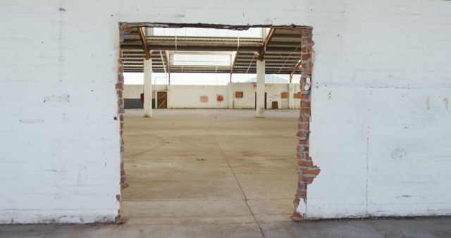 Partially demolished brick wall in empty warehouse - Download Free Stock Images Pikwizard.com