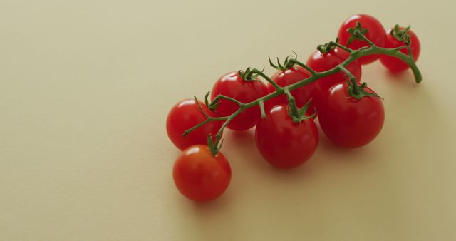 Image of fresh cherry tomatoes with copy space on yellow background - Download Free Stock Photos Pikwizard.com
