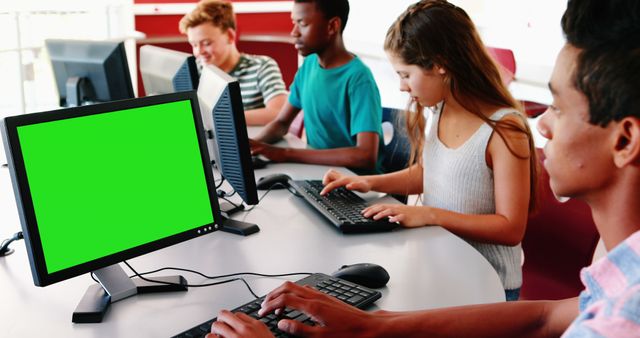 Diverse Students Using Computers with Green Screens in Classroom - Download Free Stock Photos Pikwizard.com