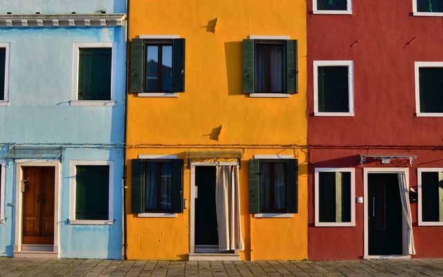 View of colorful row houses on the street. Urban architecture concept