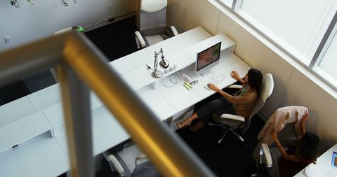 Professional Women Collaborating in Modern Office