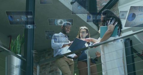 Diverse Team Analyzing Holographic Data in Modern Office