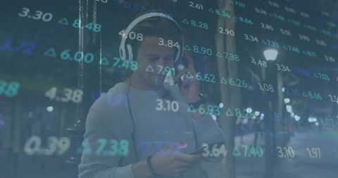 Man using smartphone with data visualization overlay