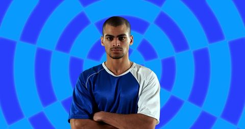 Confident Athlete Posing Against Abstract Blue Design