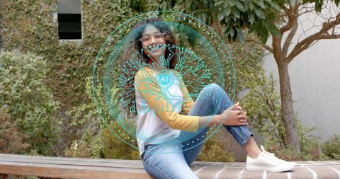 Teenager Sitting on Bench Wearing Raglan Shirt Featuring Futuristic AI Circuit Overlay
