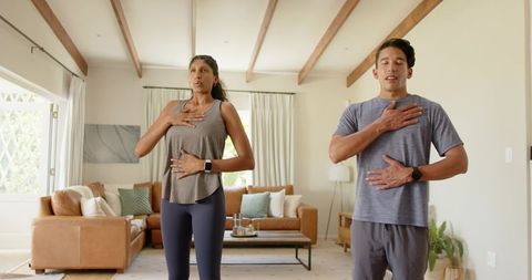 African american couple practicing mindful breathing at home for wellness and calm routine