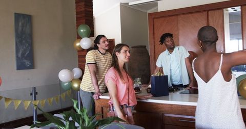 Diverse Group Enjoying Social Gathering in Home Kitchen