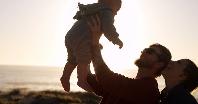 Happy Family Enjoying Sunset on Beach - Download Free Stock Images Pikwizard.com