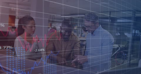 Intercultural Team Analyzing Financial Charts in Modern Office