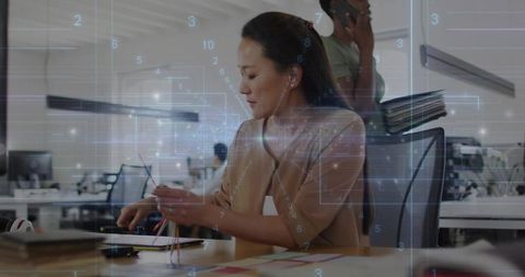 Businesswoman Collaborating with Digital Interface in Modern Office