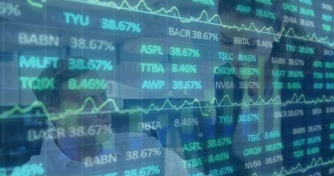 Business Colleagues Analyzing Data in High-Tech Trading Room