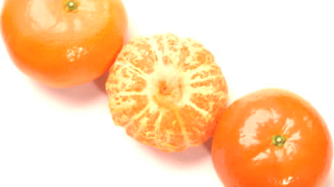 Fresh Whole and Peeled Mandarin Oranges on White Background