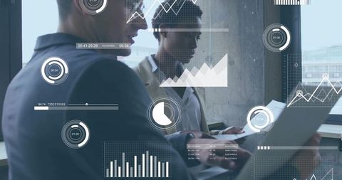 Business colleagues reviewing laptop data with floating analytics overlays and charts