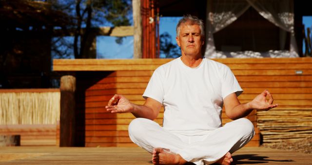 Senior Man Meditating in Outdoor Retreat Area - Download Free Stock Images Pikwizard.com