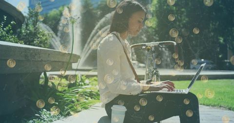 Woman Utilizing Laptop with Blockchain Technology in Park Setting