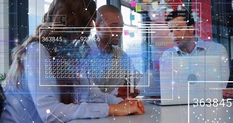 Collaborating around laptop with augmented reality data overlays in modern office