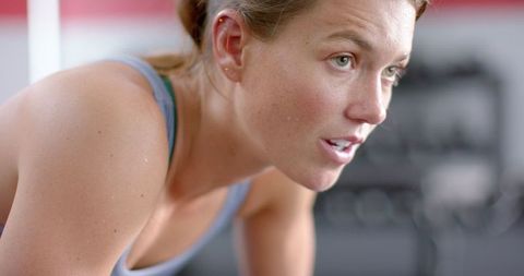 Focused Athletic Caucasian Woman Intense Gym Workout