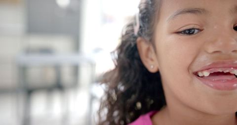 Smiling young girl in classroom environment