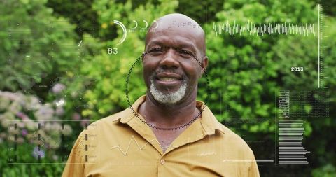 Senior man smiling in garden wearing mustard shirt with futuristic hud data and analytics overlay
