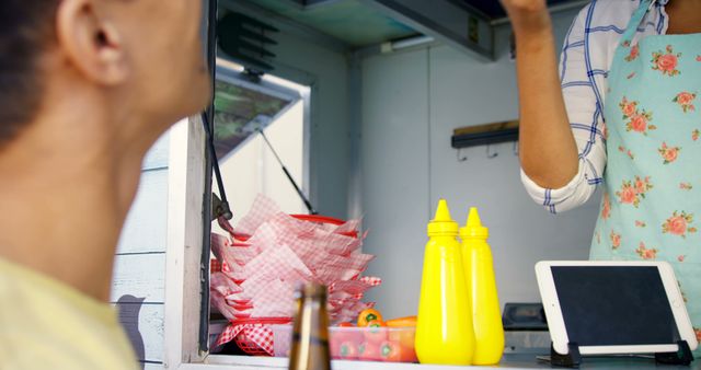 Customer Ordering at Food Truck with Condiments and Digital Tablet - Download Free Stock Images Pikwizard.com