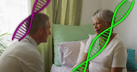 Clinician discussing genetic health with elderly patient during home bedside visit
