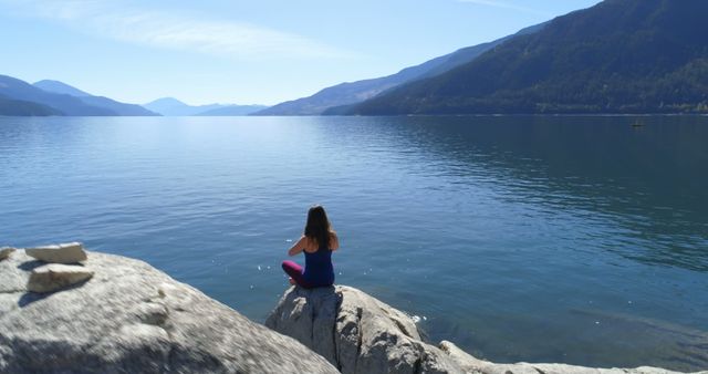 Woman Meditating at Scenic Mountain Lake - Download Free Stock Images Pikwizard.com