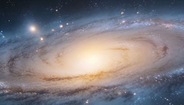 Spiral galaxy glowing with bright bulge and swirling dust lanes, stellar halo detail