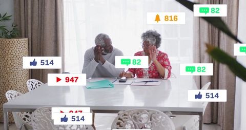 Senior couple engaging with social media feedback at home