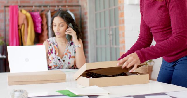 Teamworking in Small Business: Packing Orders and Managing Communications - Download Free Stock Images Pikwizard.com