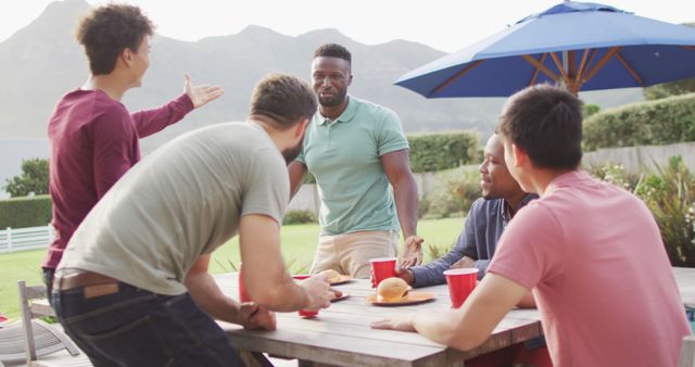 Friends Enjoying Outdoor Barbecue on Sunny Day - Download Free Stock Images Pikwizard.com