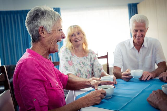 Seniors Enjoying Coffee Together in Retirement Home - Download Free Stock Photos Pikwizard.com