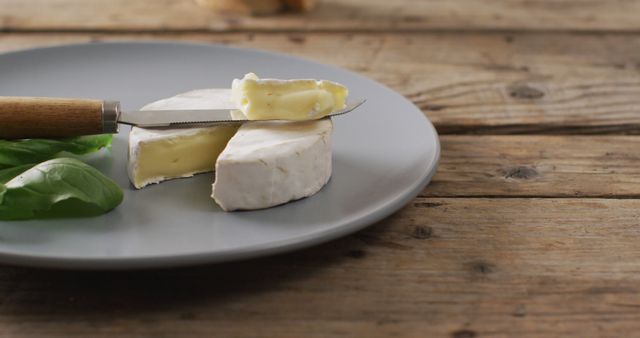 Creamy Brie Cheese with Knife on Gray Plate - Download Free Stock Images Pikwizard.com