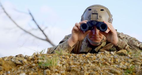 Military Soldier Surveys Terrain Through Binoculars in Training Exercise - Download Free Stock Images Pikwizard.com