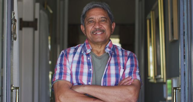 Confident Senior Man with Arms Crossed in Plaid Shirt - Download Free Stock Images Pikwizard.com