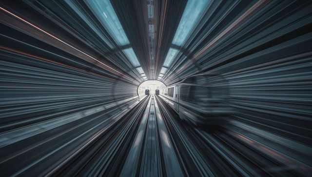 High-speed subway train racing through futuristic tunnel