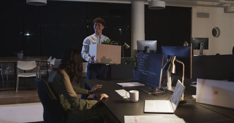 Team Collaboration at Night in Modern Office