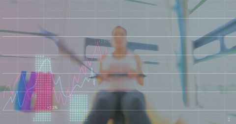 Mid-adult woman rowing on ergometer with performance charts overlaying fitness analytics