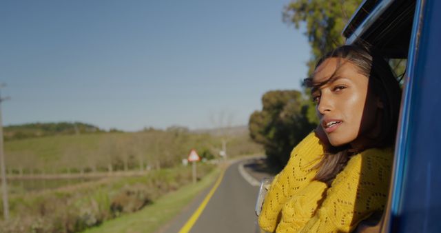 Woman Enjoying Road Trip with Head Out of Car Window - Download Free Stock Images Pikwizard.com