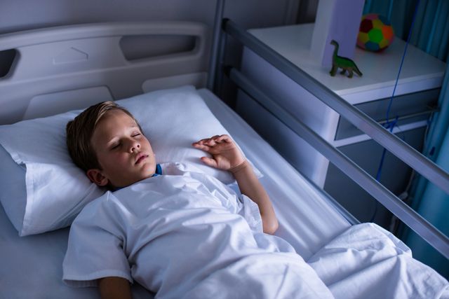 Young Boy Sleeping in Hospital Bed - Download Free Stock Photos Pikwizard.com