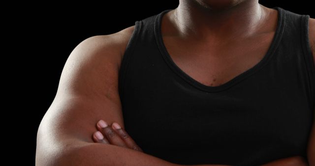 Confident Muscular Person Crossing Arms Wearing Black Tank Top - Download Free Stock Images Pikwizard.com