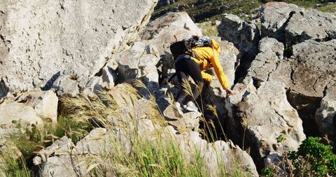 Adventurous Climber Exploring Challenging Rocky Terrain Outdoors - Download Free Stock Images Pikwizard.com