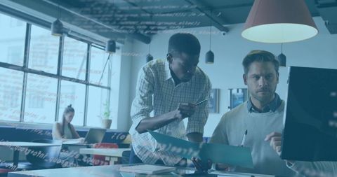 Developers collaborating in modern industrial workspace