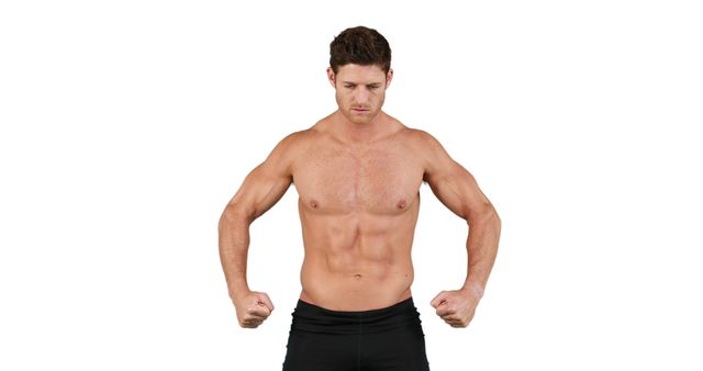 A muscular Caucasian man is posing to showcase his fit physique, with copy space. His stance exudes confidence and highlights a healthy, active lifestyle.
